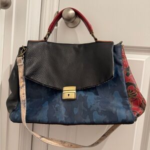 Elegant Black and Blue Satchel with Red Accents